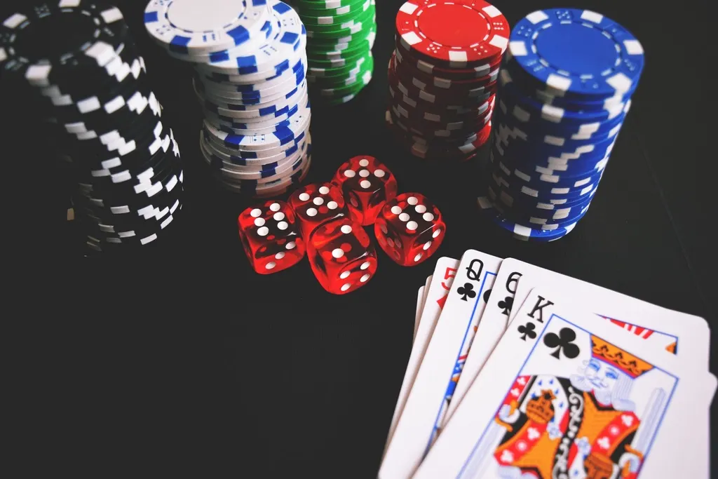 Casino chips arranged on a dark gaming surface